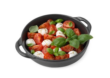 Tasty salad Caprese with mozarella balls, tomatoes and basil on white background