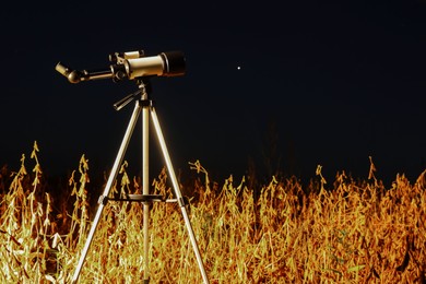 Photo of New telescope for astronomy at night outdoors