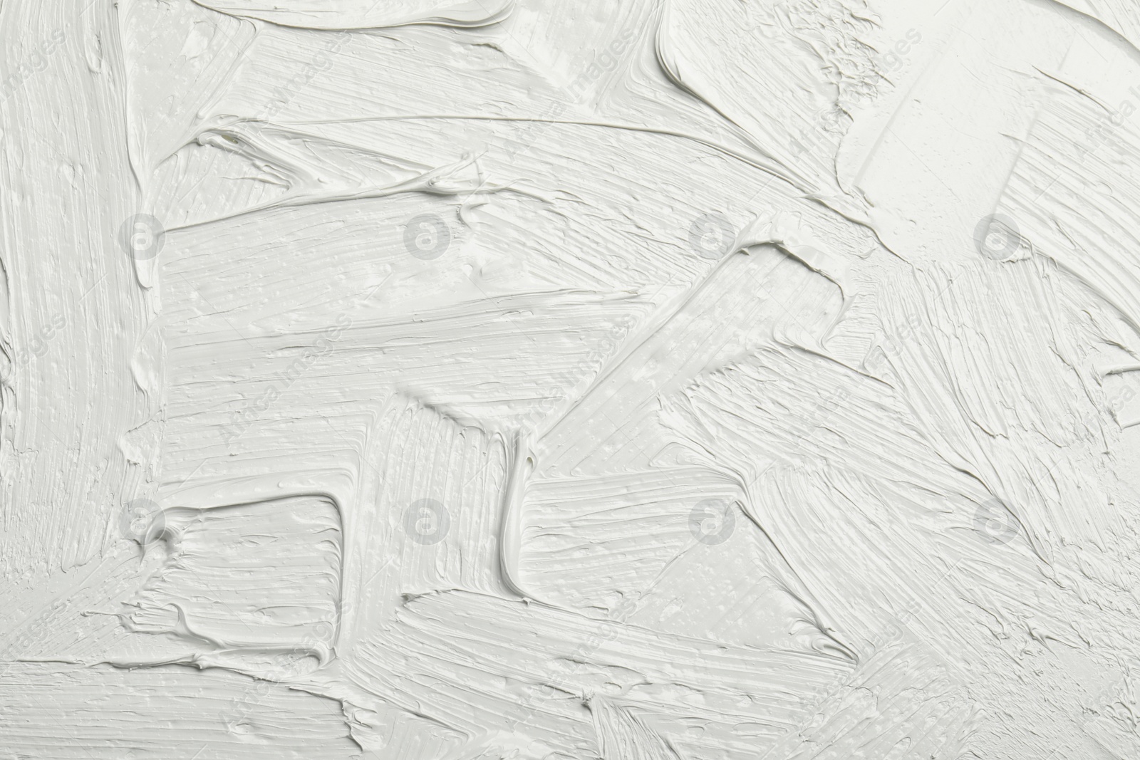 Photo of Texture of white oil paint as background, closeup