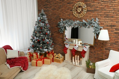 Stylish interior with beautiful Christmas tree and decorative fireplace, above view