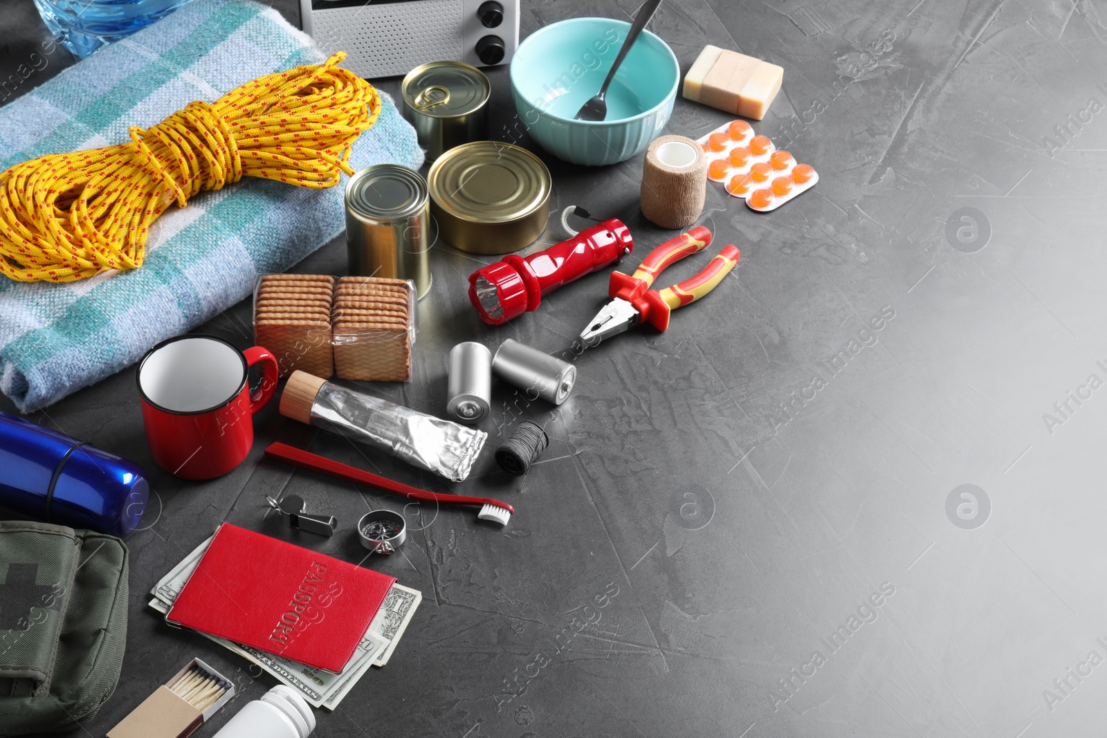 Photo of Earthquake supply kit on dark grey table. Space for text