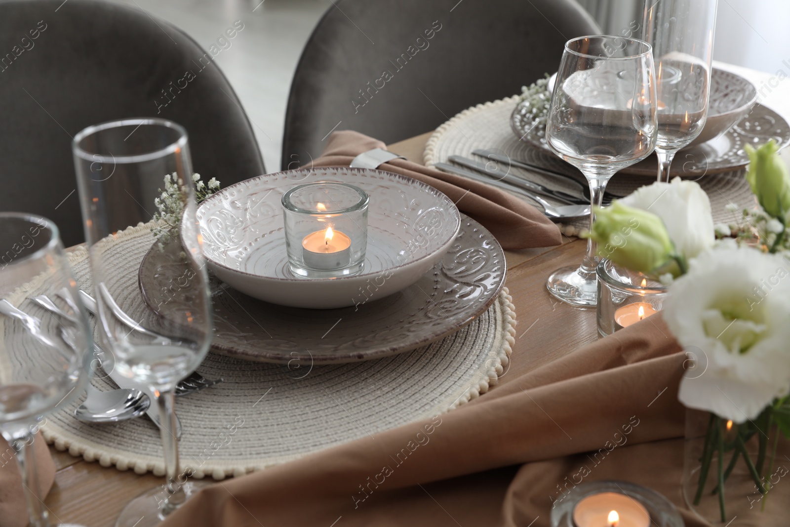 Photo of Festive table setting with beautiful floral decor in restaurant