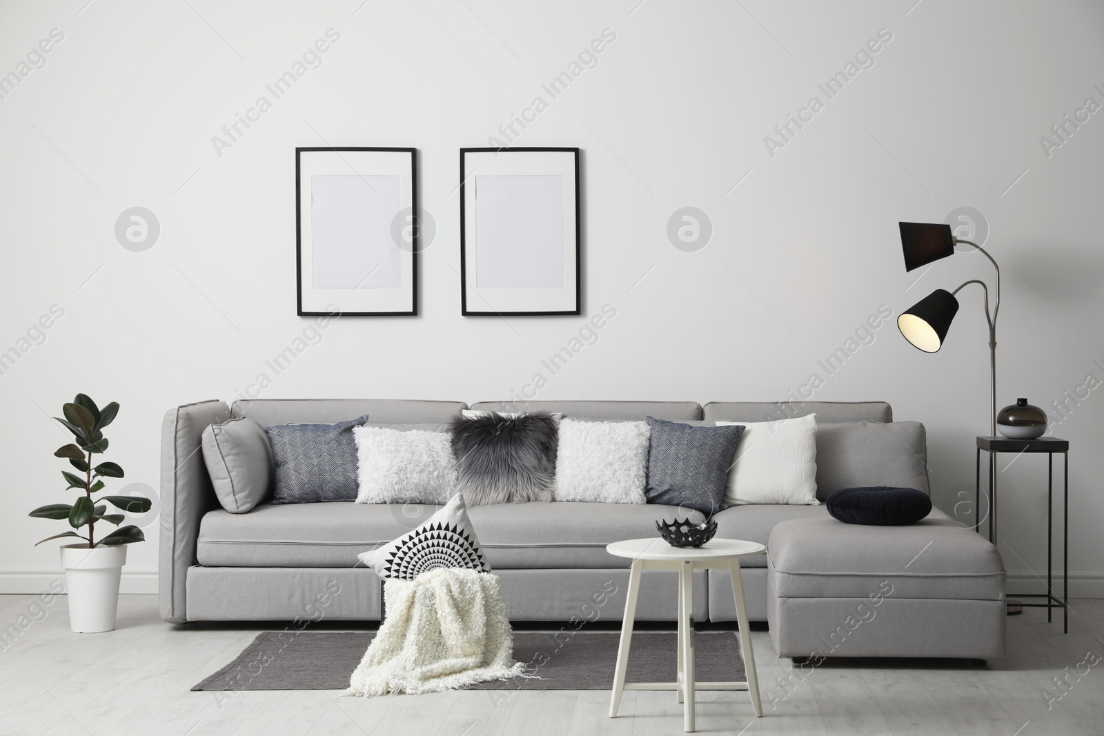 Photo of Stylish living room interior with comfortable sofa