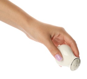 Photo of Woman holding ceramic salt or pepper shaker on white background, closeup