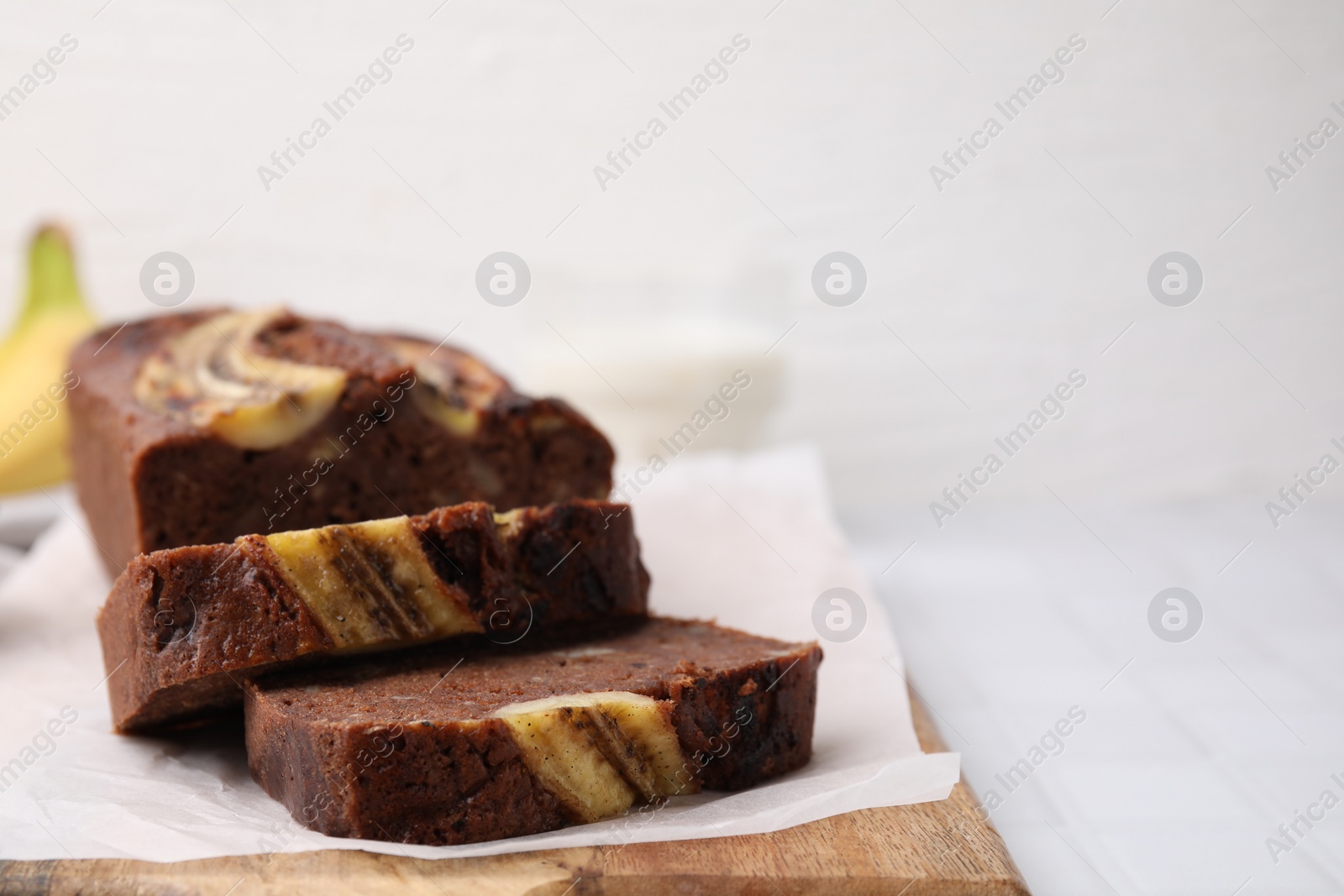 Photo of Delicious homemade banana bread on table, closeup. Space for text