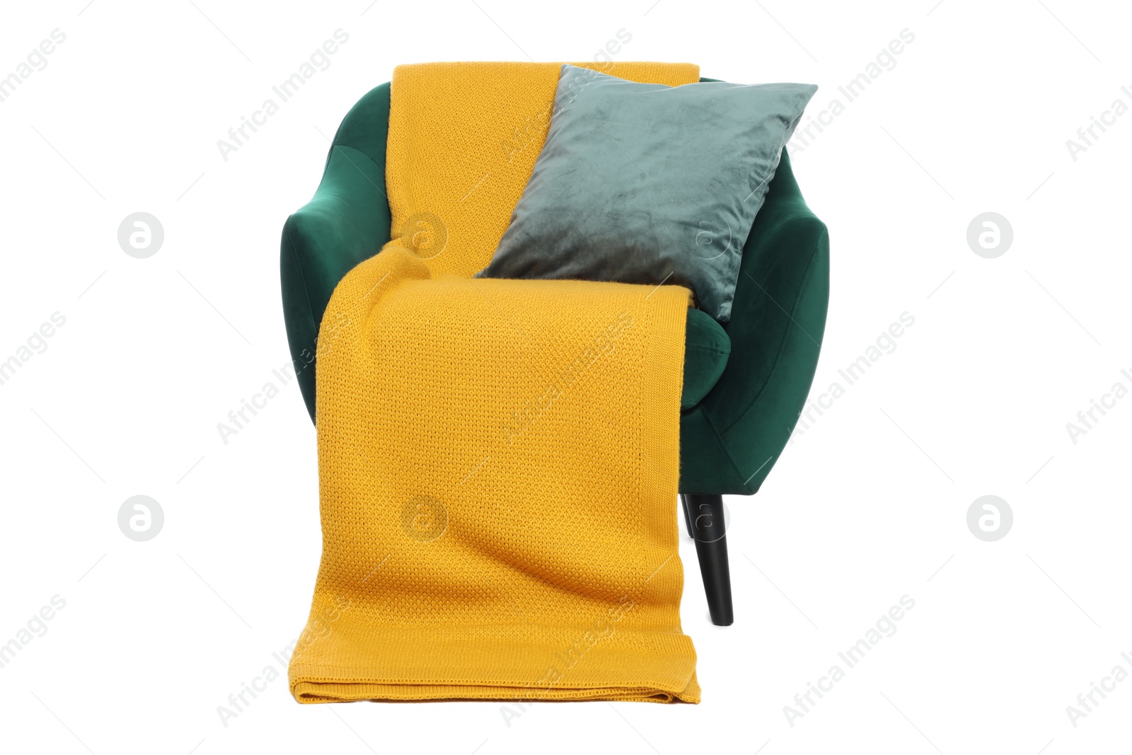 Photo of One stylish comfortable armchair with pillow and blanket isolated on white