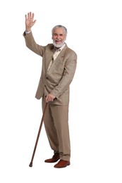 Senior man with walking cane waving on white background