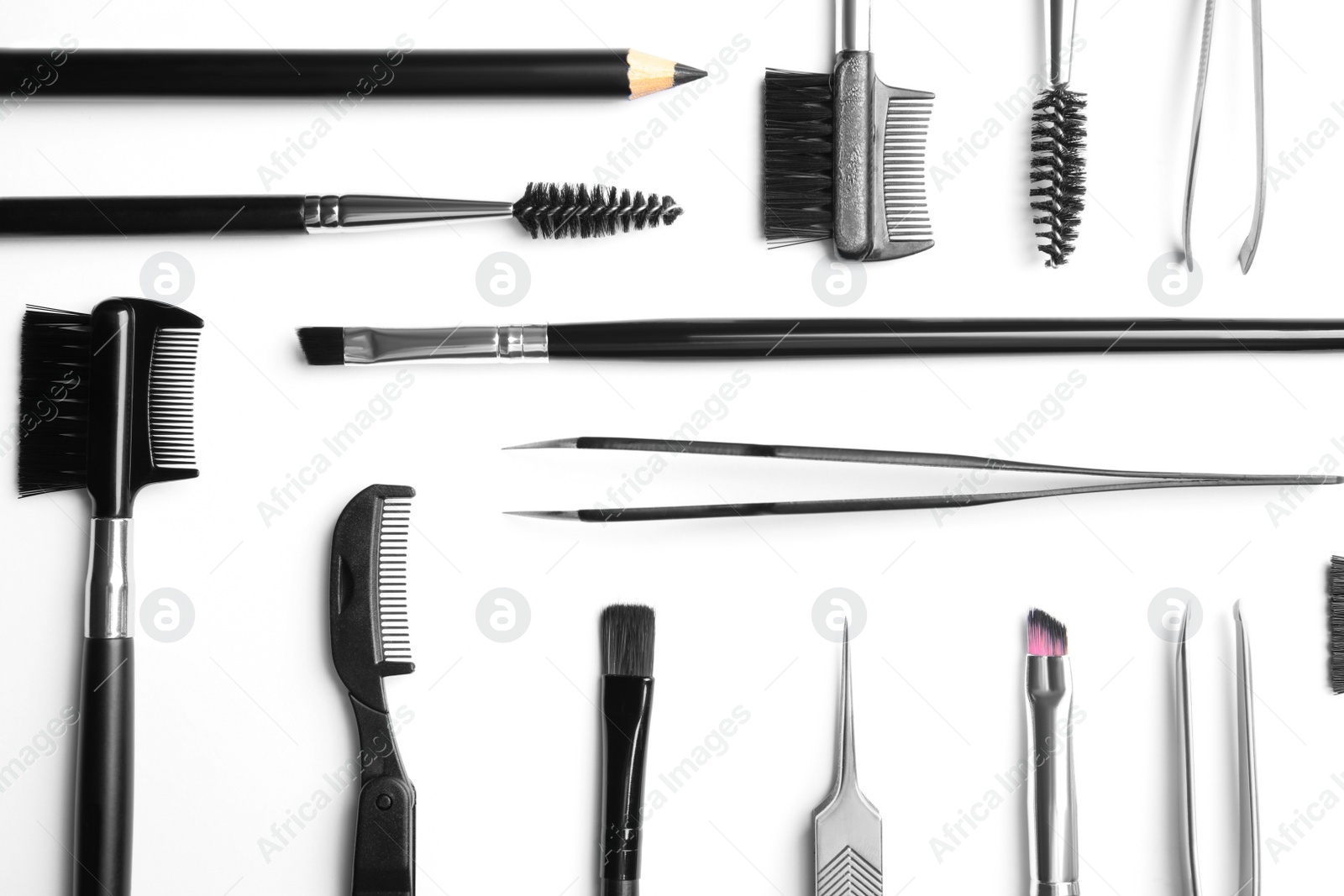 Photo of Set of professional eyebrow tools on white background, top view