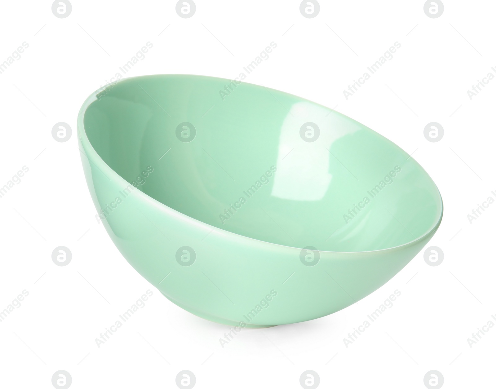 Photo of Clean light green bowl isolated on white