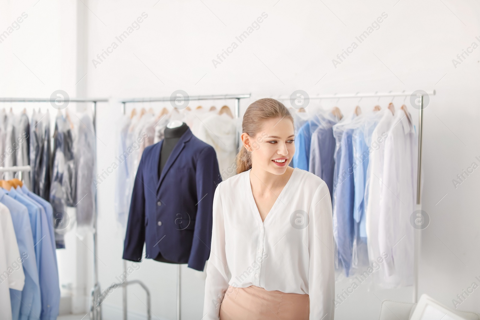 Photo of Portrait of young woman in dry-cleaner's