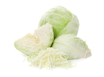 Whole and cut fresh ripe cabbages on white background