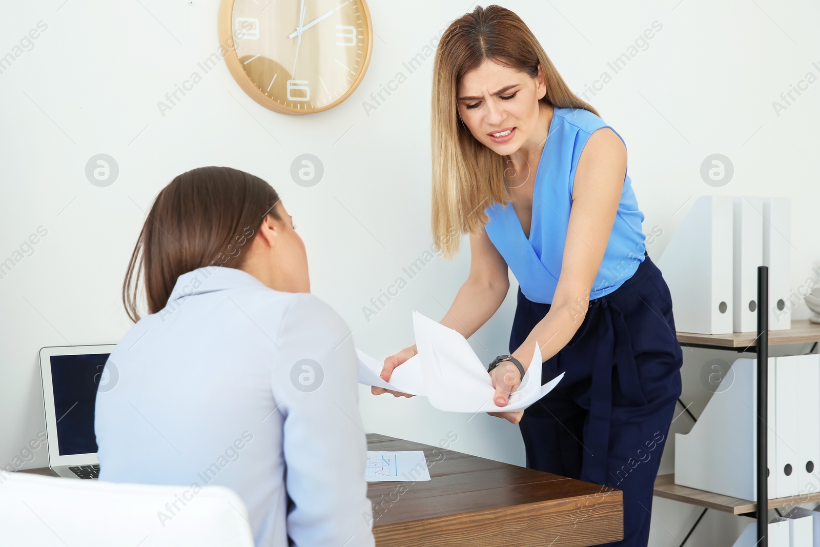 Photo of Office employees having argument at workplace