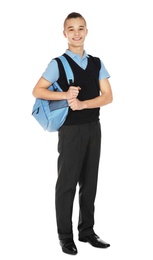 Full length portrait of teenage boy in school uniform with backpack on white background