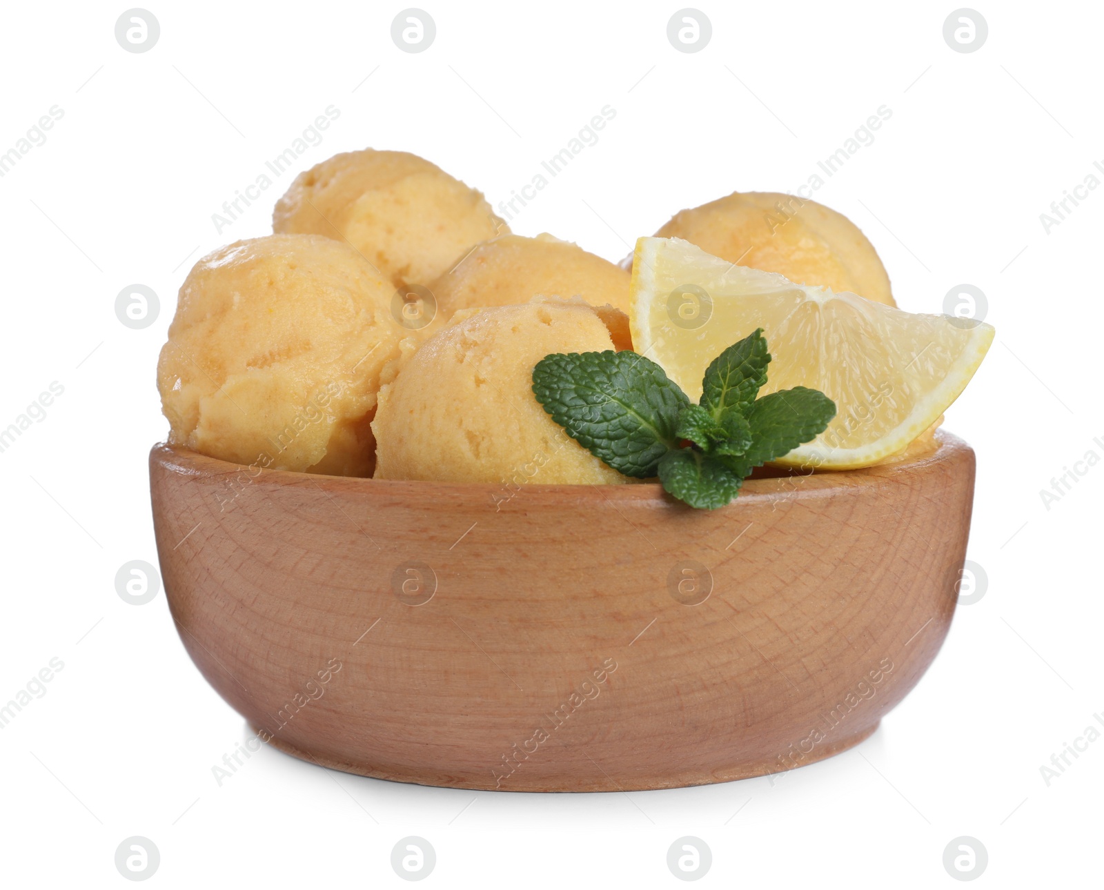 Photo of Delicious yellow ice cream with mint and lemon in wooden bowl isolated on white