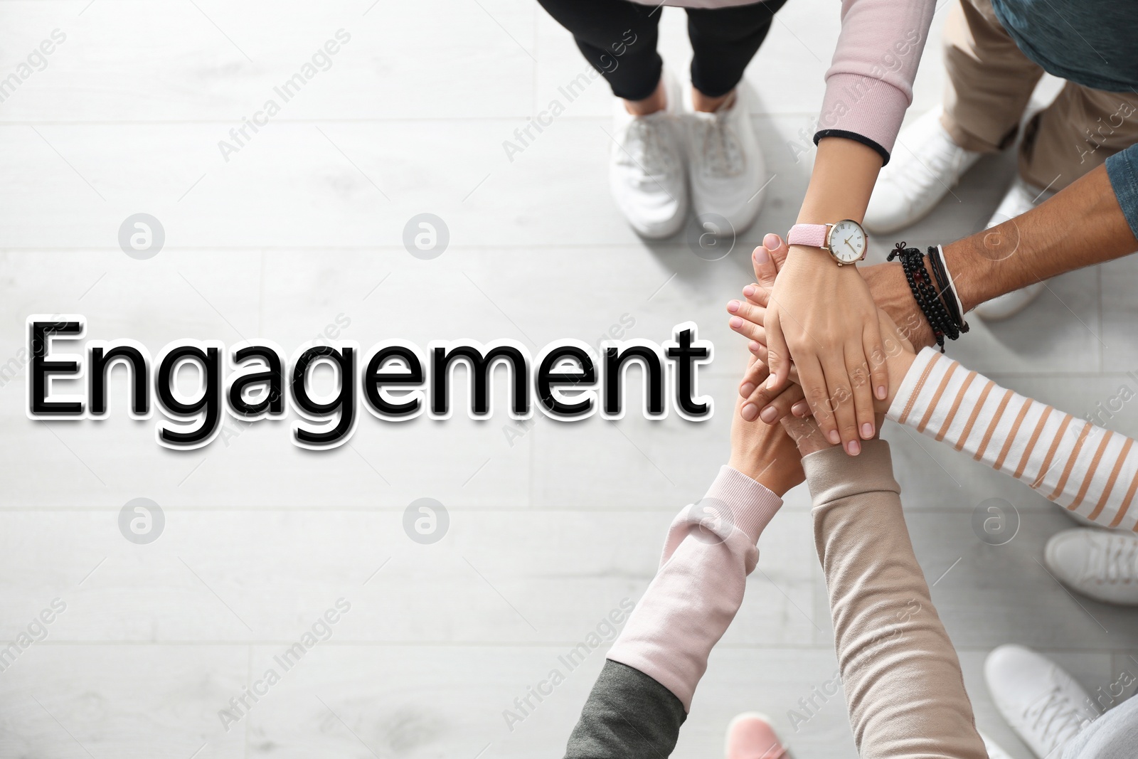 Image of Engagement concept. People holding hands together, top view 