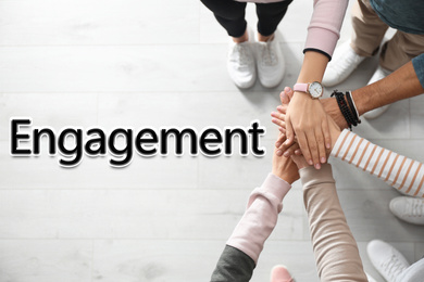 Engagement concept. People holding hands together, top view 