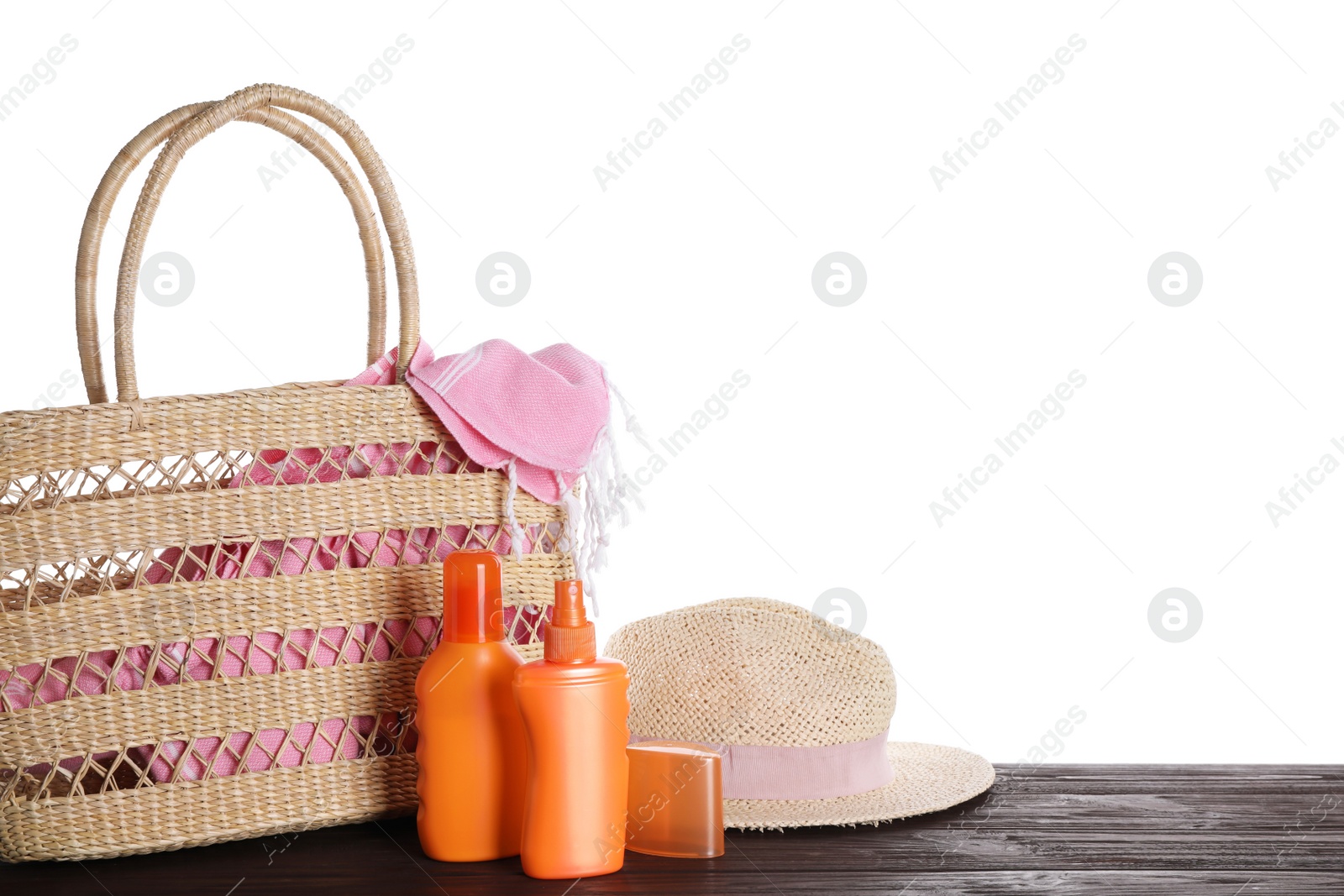 Photo of Composition with sun protection products on wooden table against white background. Space for text