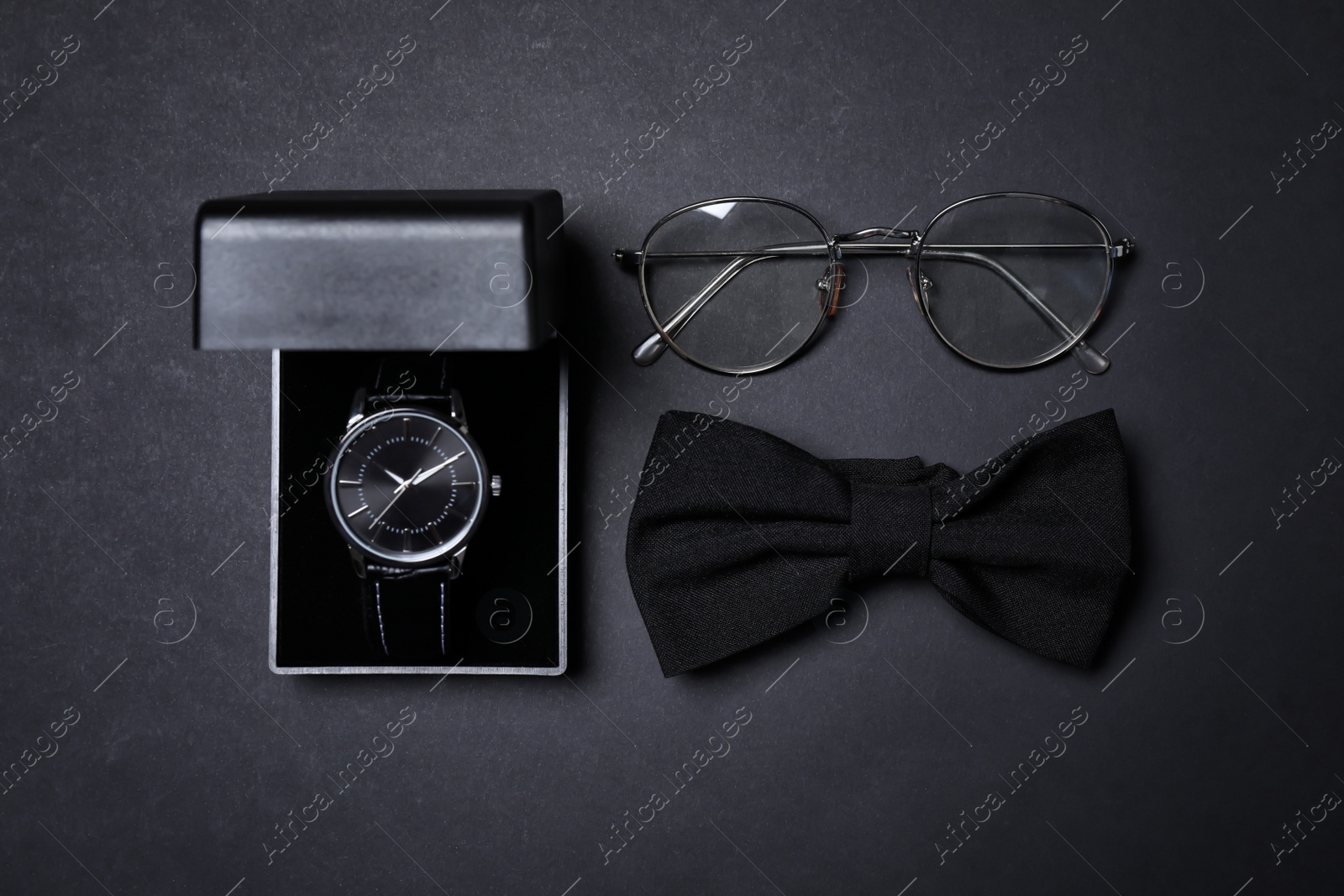 Photo of Men set with stylish accessorizes on black background, flat lay