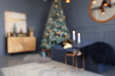 Blurred view of living room interior with Christmas tree and festive decor