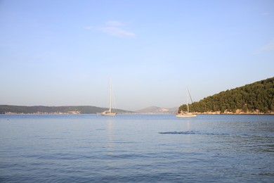 Photo of Beautiful view of tranquil sea and yachts on summer day