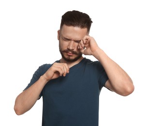 Photo of Young man suffering from eyestrain on white background