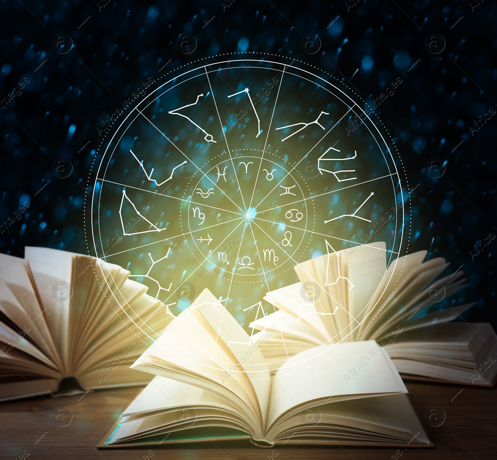 Image of Open book on wooden table and illustration of zodiac wheel with astrological signs