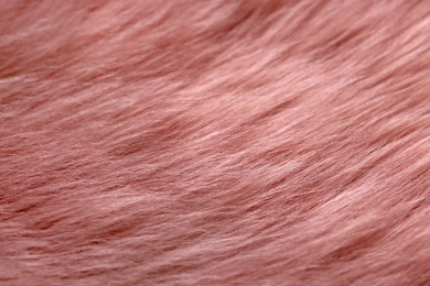 Photo of Pink faux fur as background, top view