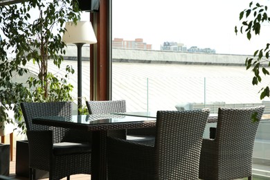 Observation area cafe. Table, chairs and green plants on terrace