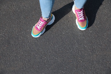 Photo of Woman walking outdoors, closeup with space for text. Choosing way concept.