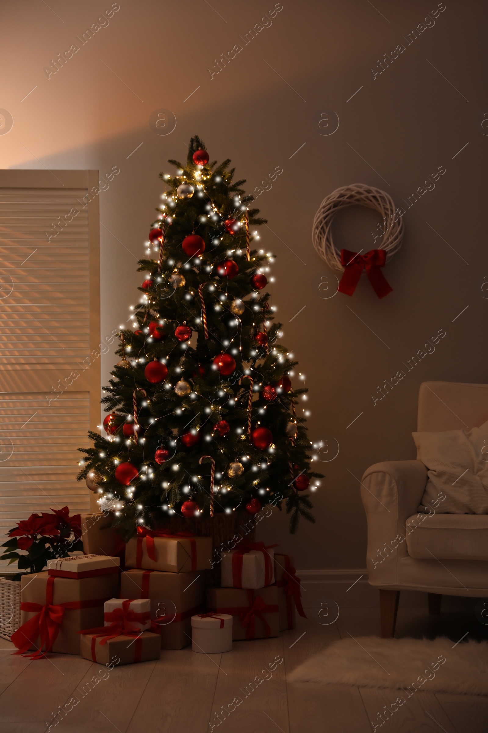 Photo of Beautiful decorated Christmas tree in living room. Festive interior