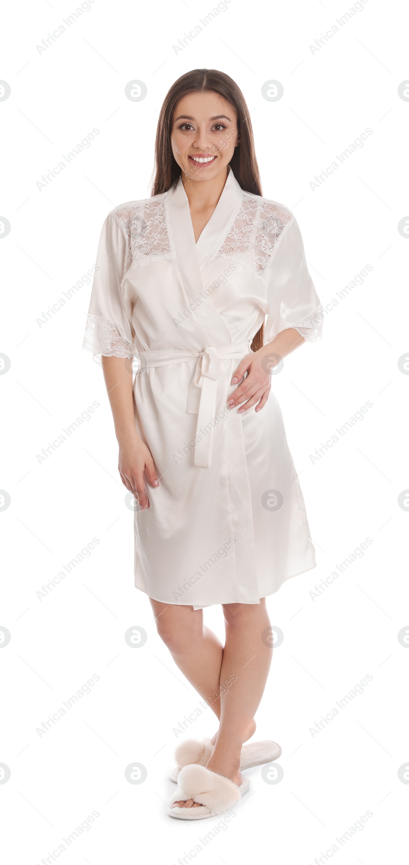 Photo of Young woman in silk robe on white background