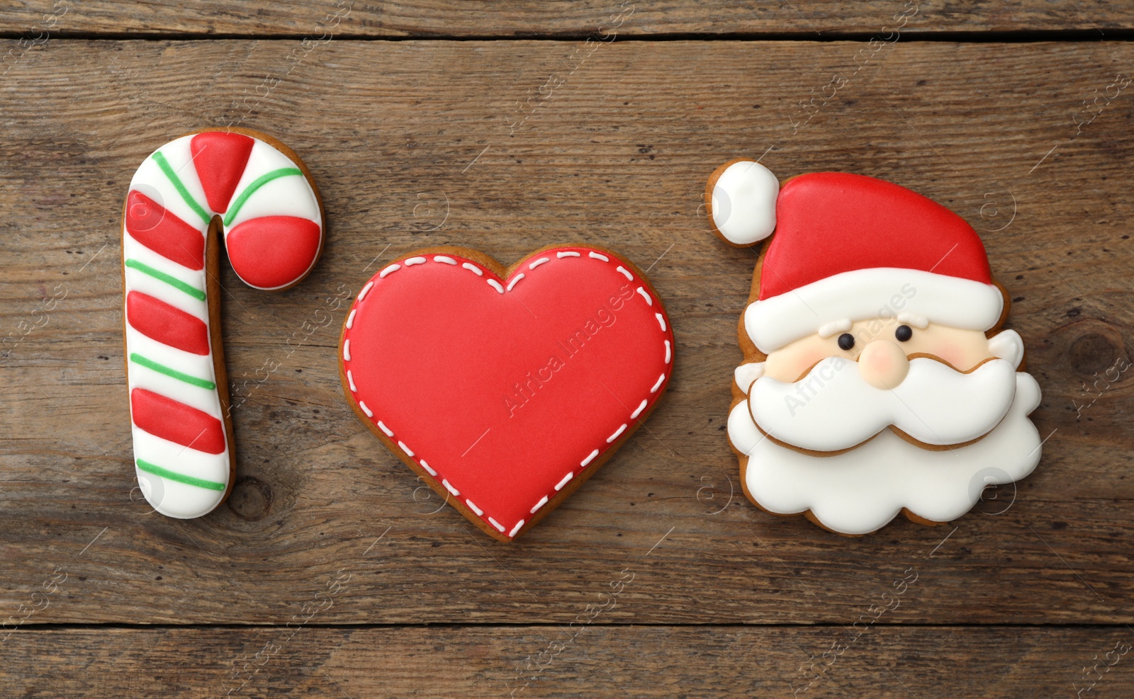 Photo of Different delicious Christmas cookies on wooden table, flat lay