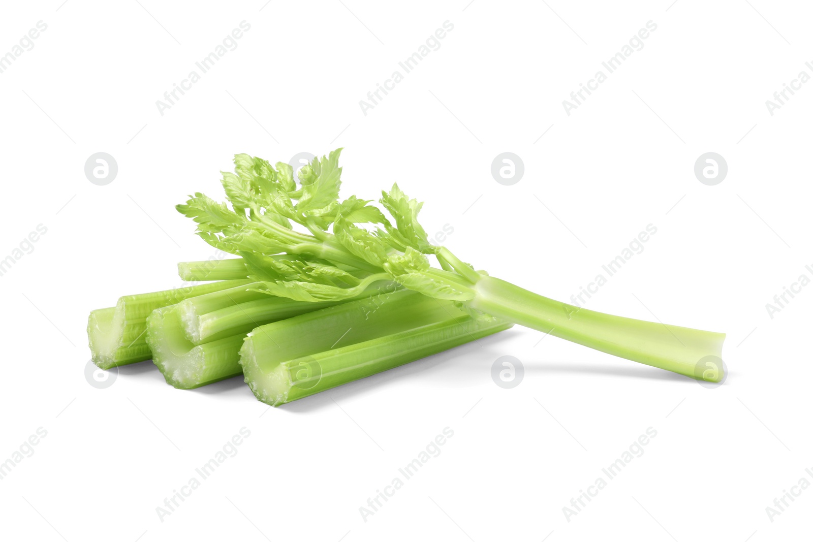 Photo of Fresh green cut celery isolated on white