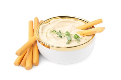 Photo of Delicious hummus with grissini sticks isolated on white