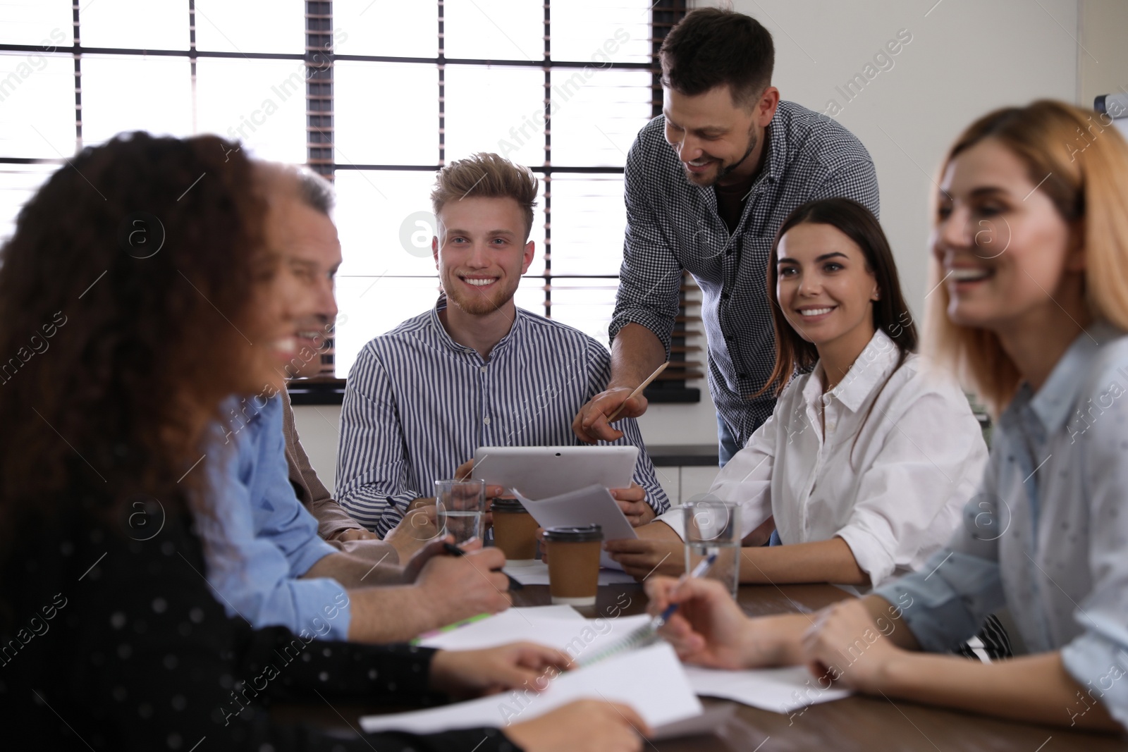 Photo of Portrait of volunteers having meeting in office