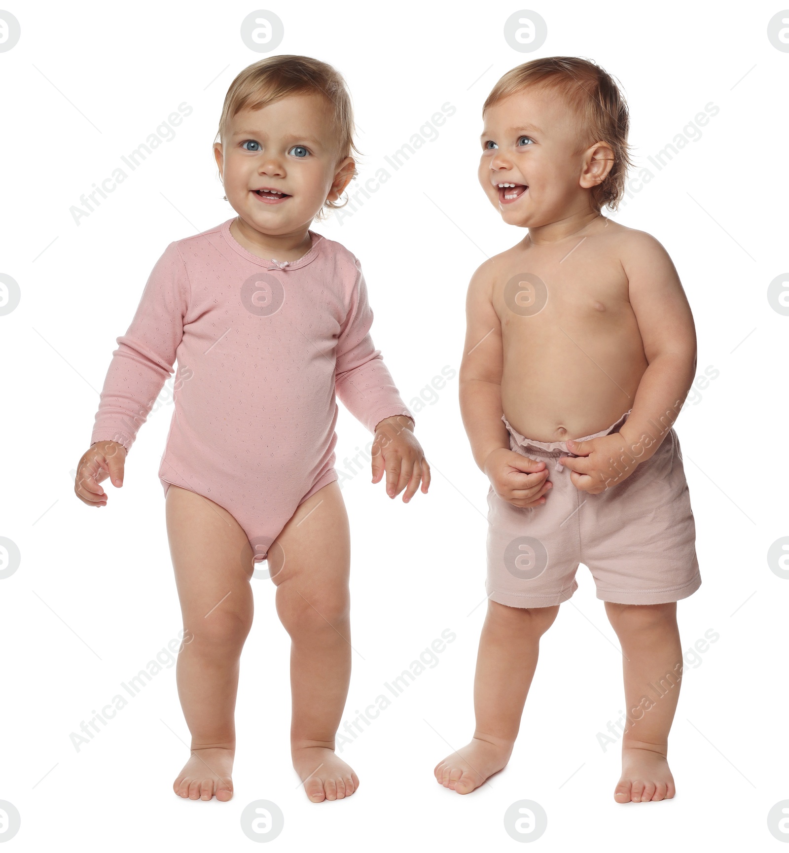 Image of Portrait of cute twin babies on white background