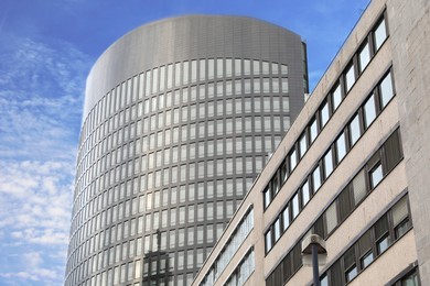 Beautiful view of modern buildings with big windows in city