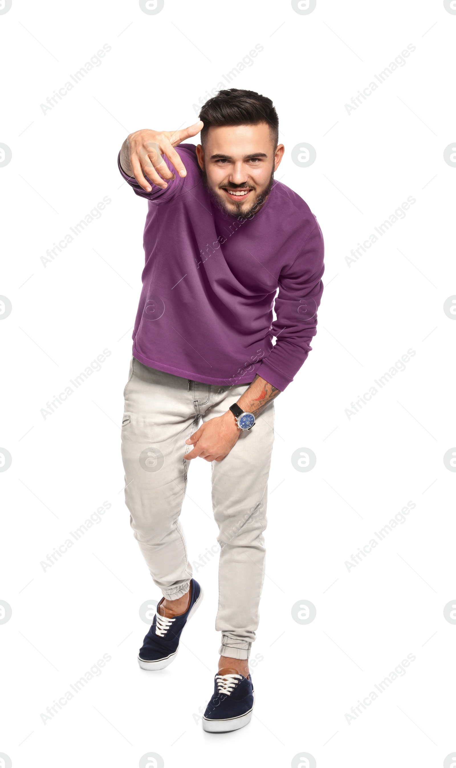 Photo of Handsome young man posing on white background