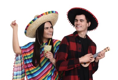 Photo of Lovely couple in Mexican sombrero hats with cocktail and ukulele on white background