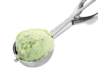 Photo of Scoop of delicious pistachio ice cream on white background