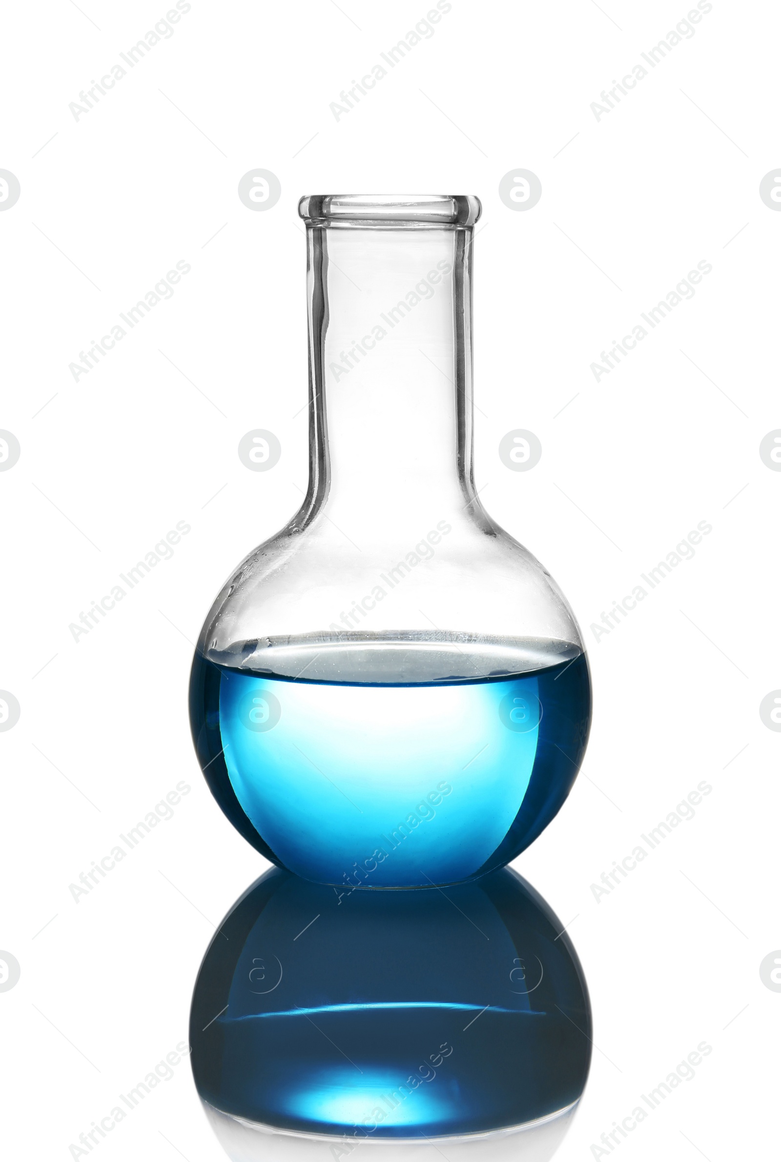 Photo of Flask with liquid on table against white background. Laboratory analysis