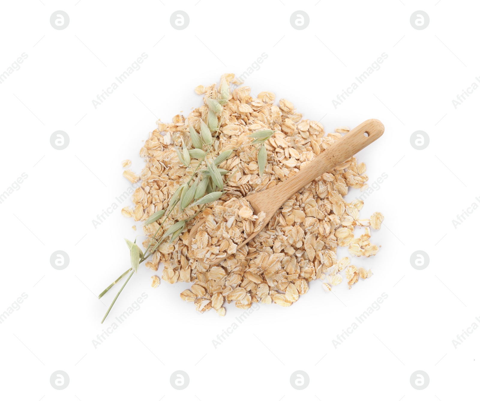 Photo of Wooden spoon with oatmeal and florets isolated on white, top view