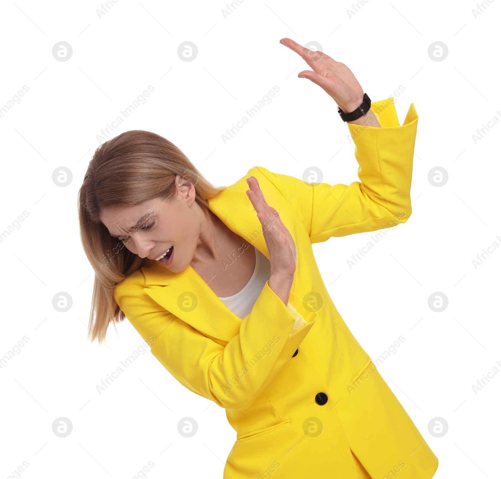 Photo of Beautiful emotional businesswoman avoiding something on white background