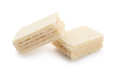 Photo of Delicious broken crispy wafer on white background. Sweet food