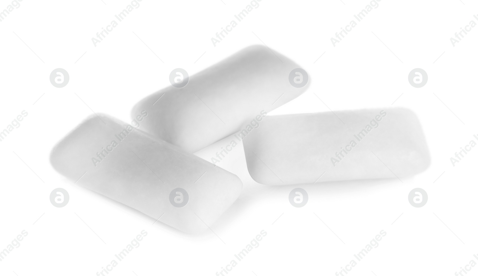 Photo of Three chewing gum pieces on white background