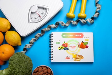Image of Information about grouping of products under their glycemic index. Notebook, almonds, fruits, broccoli, dumbbells, measuring tape and floor scale on light blue background, flat lay