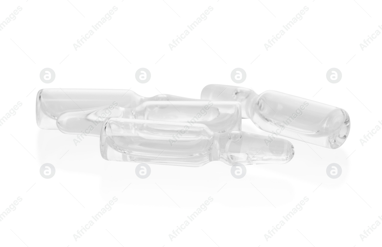 Photo of Glass ampoules with liquid isolated on white