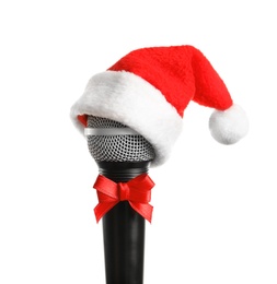 Photo of Microphone with Santa hat and bow on white background. Christmas music concept