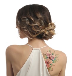 Image of Young woman with beautiful floral tattoo on white background, back view