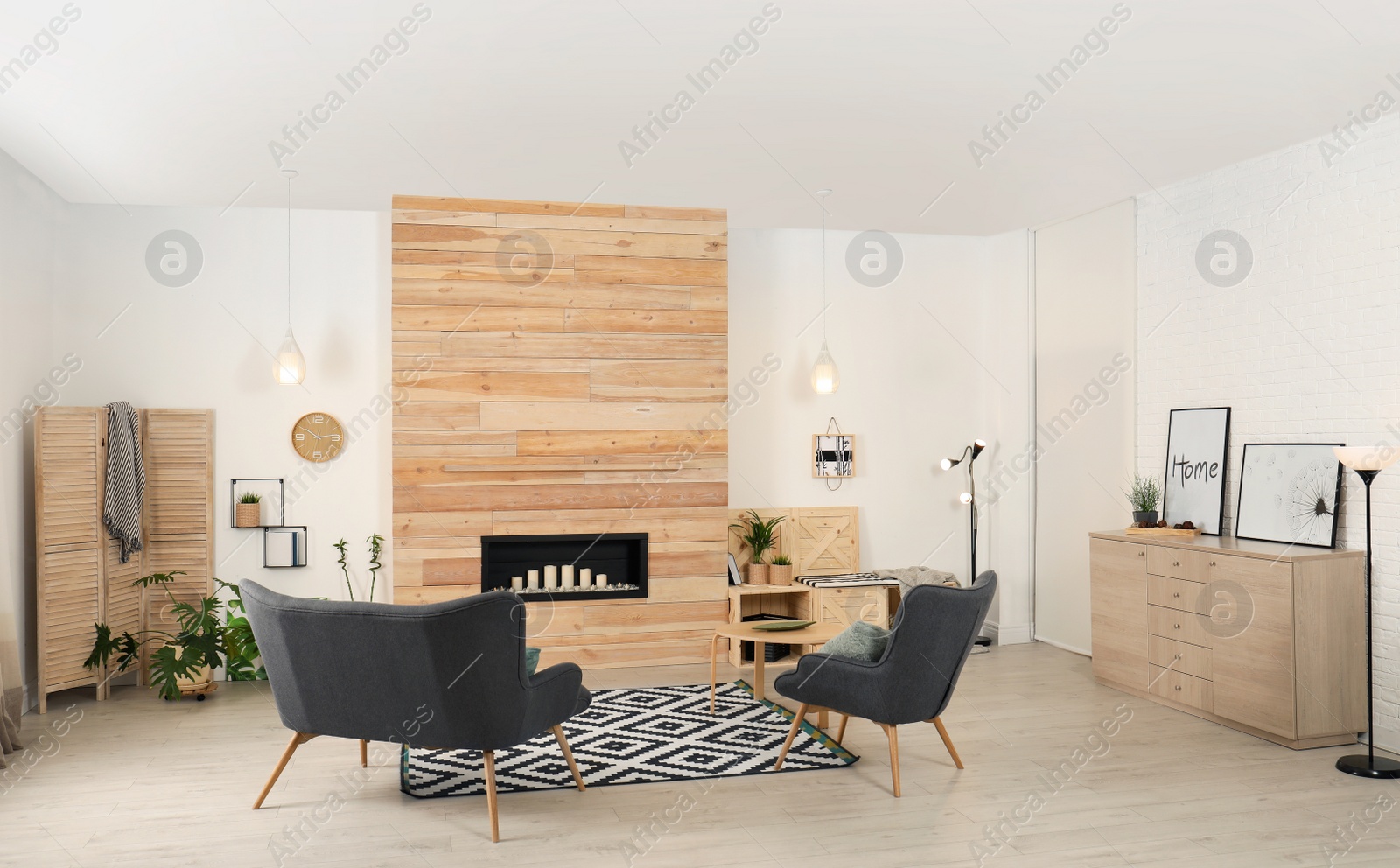 Photo of Living room interior with decorative fireplace in wooden wall